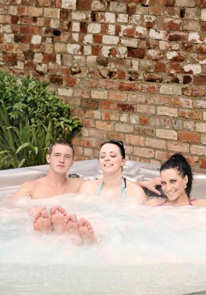 3 people hot tub pool and spa